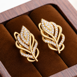 Luxury gold leaf crystal stud earrings with sparkling cubic zirconia stones for women, elegant gold-plated fashion jewelry for weddings, parties, and everyday wear.